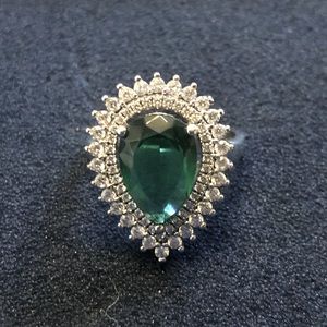STERLING SILVER RING w/ emerald and white crystal stones.